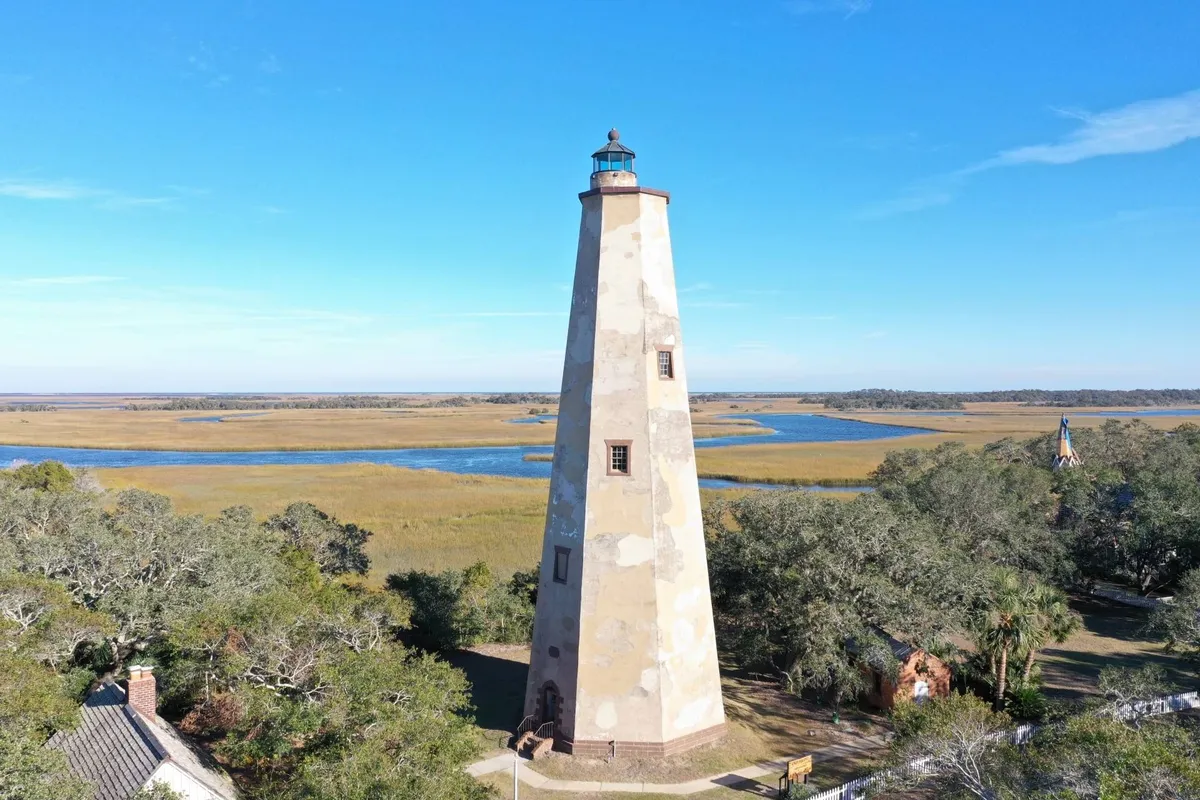 A classic lighthouse surrounded by marshland and waterways. The area offers a sense of island exploration, with opportunities for bird watching, photography, and learning about local history.